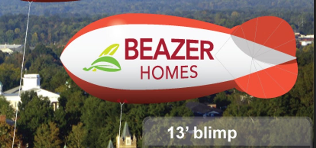 13 ft red and white marketing blimp flying for Beazer Homes