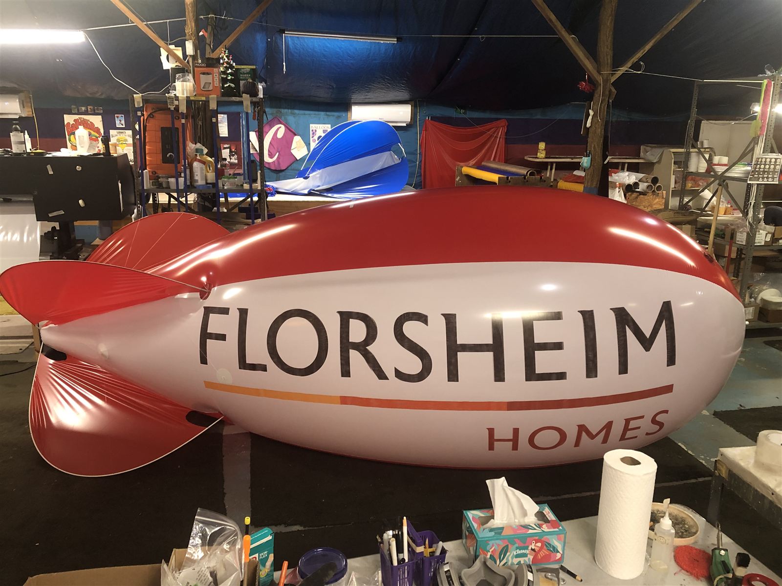 13 ft polyurethane advertising blimp with Florsheim Homes lettering at a trade show